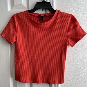 This cute crop top is from forever 21 size medium the color is this coral red